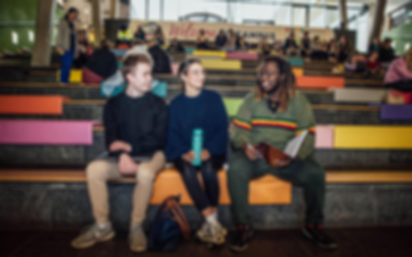 Students sitting on steps in TARA forum