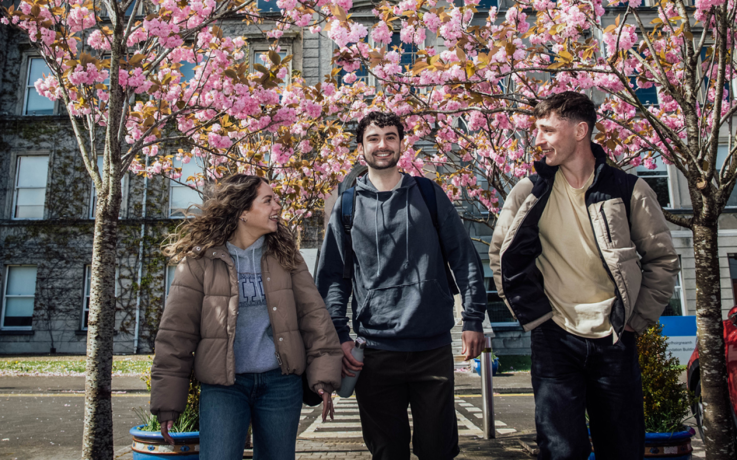 Three students in front of the main building MIC Limerick