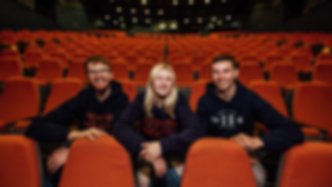 Three students sitting in the Lime Tree Theatre MIC Limerick