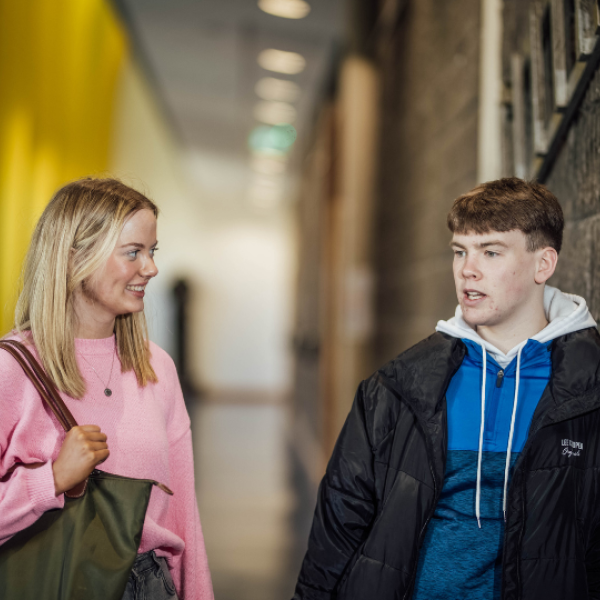 Two students chatting in the TARA Building