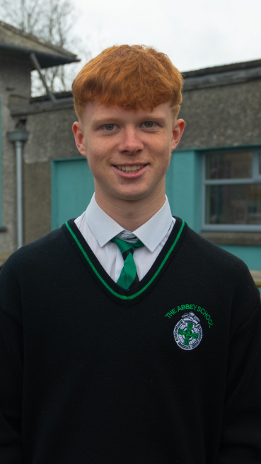 Male secondary school student in school yard as part of male teachers CAO campaign