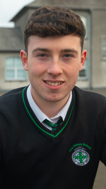 Male secondary school student in school yard as part of male teachers CAO campaign