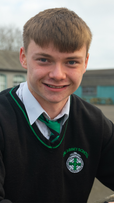 Male secondary school student in school yard as part of male teachers CAO campaign