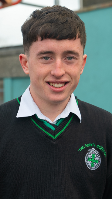 Male secondary school student in school yard as part of male teachers CAO campaign