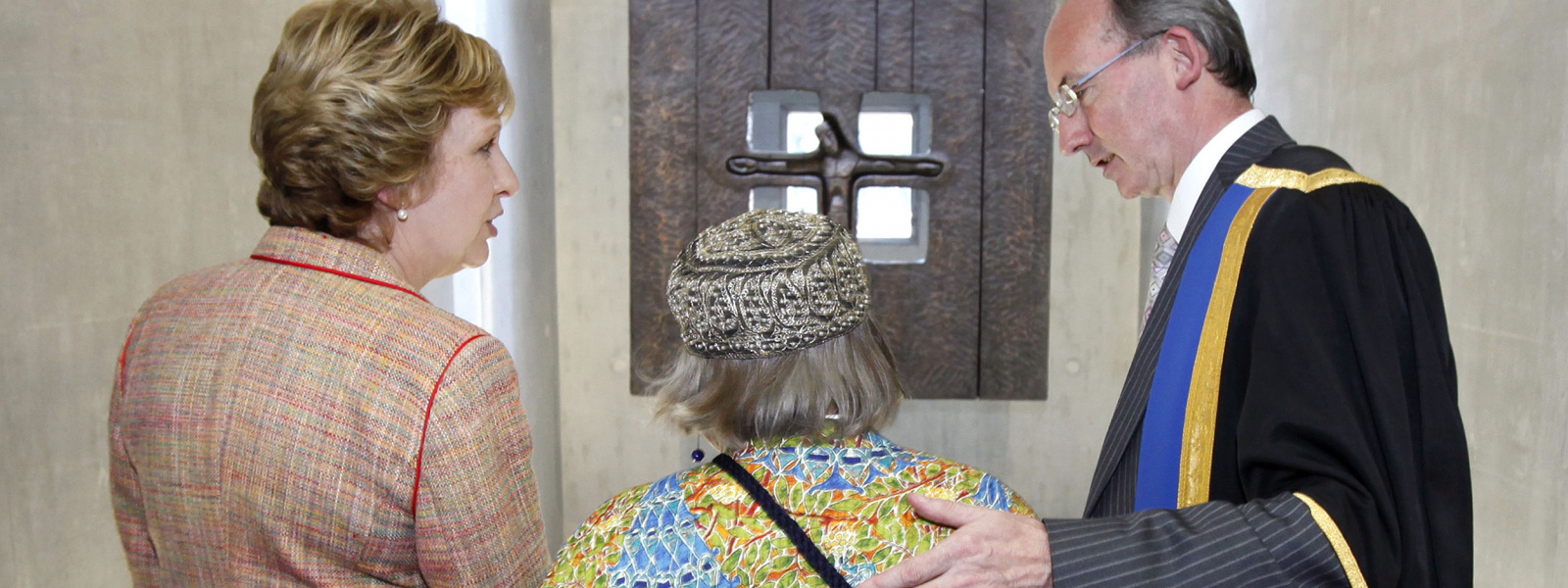 Former President of Ireland Mary McAleese, Imogen Stuart RHA, and the late Prof. Peadar Cremin, former President of MIC standing in front of Imogen's piece Window on the World. 