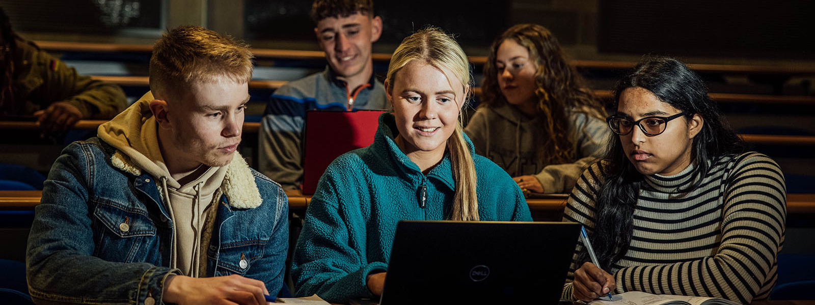 Undergraduate students sitting in a lecture hall at MIC.