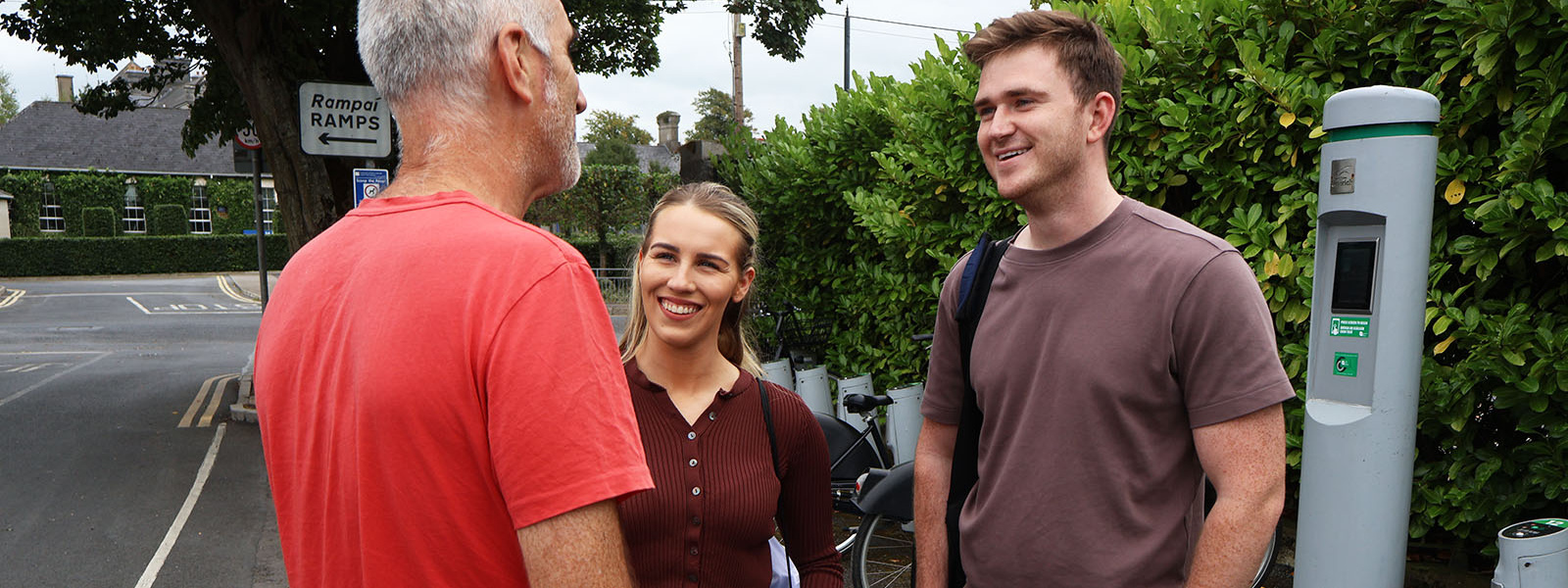 Students talking to local resident outside MIC Limerick campus