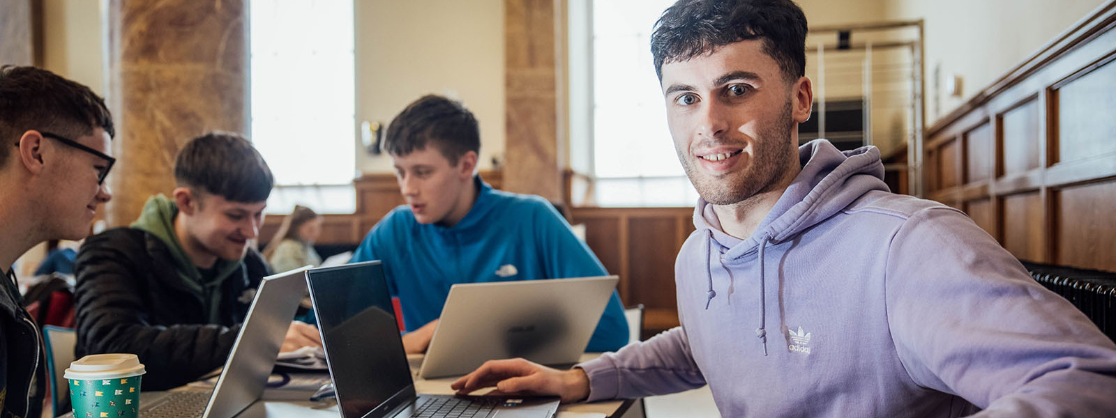 Undergraduate students sitting at a table in the canteen at MIC Thurles.
