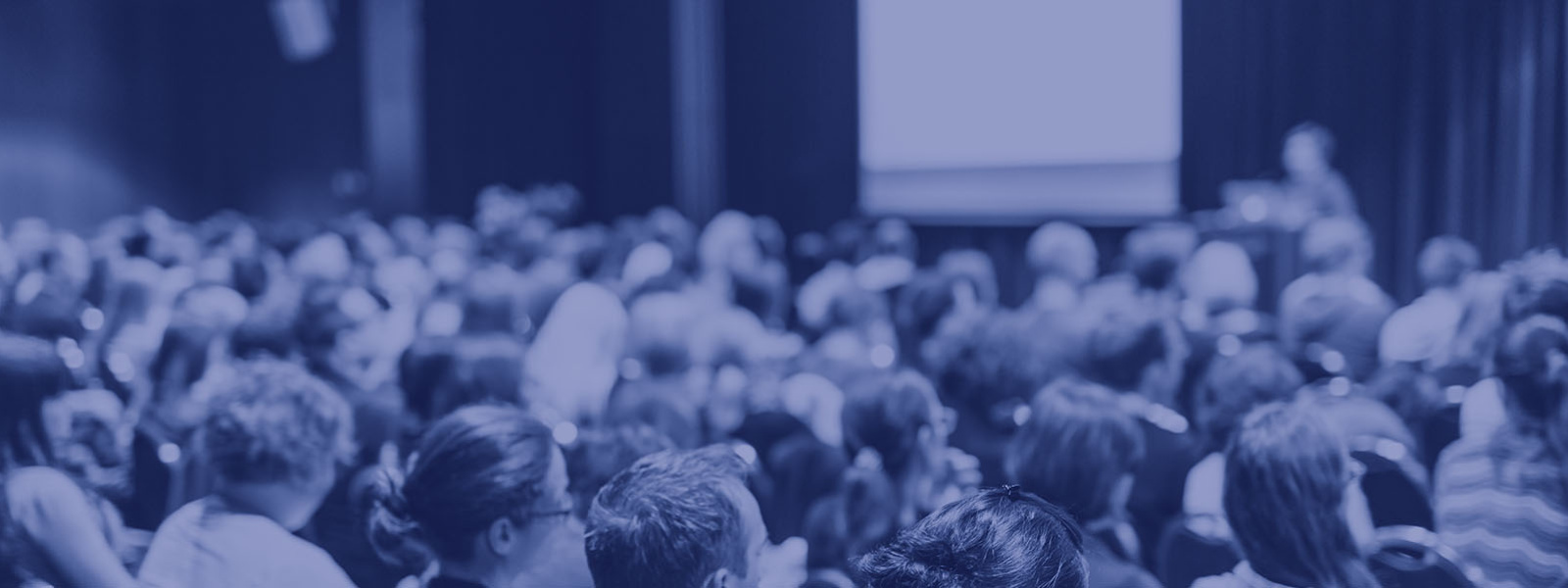 Faculty of Arts lecture series image - audience in lecture room with blue overlay
