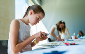 Young girl sitting at table