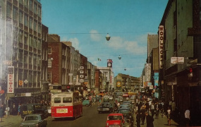 Colour image of a bustling Limerick City in the mid 20th Century