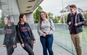 MIC students talking on the Tailteann balcony on MIC Limerick campus