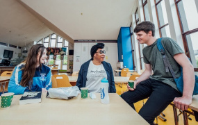 two female and one male student at MIC Limerick chatting in the College restaurant