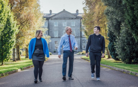 Three MIC Green Campus Thurles members in front of campus building