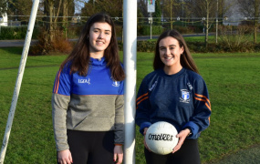 Rachel Dwyer and Ciara O'Brien leaning on either side of a goal post