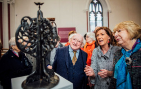President Higgins, his wife Sabina and the curator of the exhibition, Naomi O'Nolan (centre)
