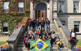 International students from Brazil on the steps outside MIC foundation building.