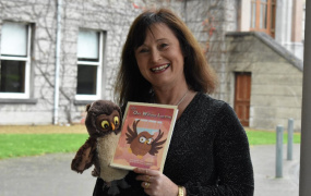 Author Fionnuala Tynan holding her book