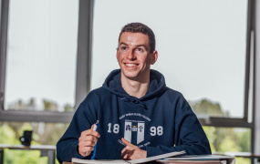 Male student sitting at desk