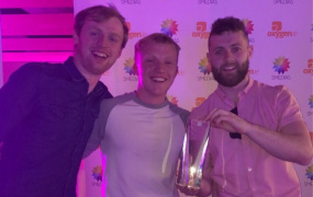 Cillian O'Callaghan pictured with Daragh Dolan and Jake O'Loughlin holding the award