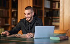 Male learner sitting at laptop