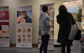 Two women looking at the exhibition materials