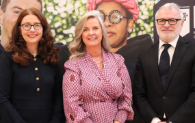 Catherine, Lorraine and Gary standing side by side at the launch of the Menopause Guidelines. Catherine and Gary are wearing navy and Lorraine is dressed in pink.