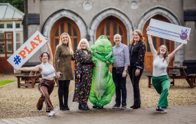 ‘Revolutionising Education Through Play’ Conference organising committee in MIC Limerick Quad with T-Rex and dancers