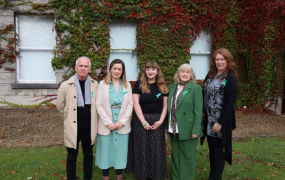 A man and four women posing for a photo for a mental health organisation