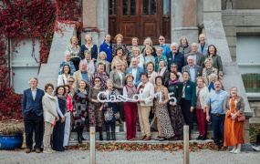 The Class of 75 posing for a photo outside Mary Immaculate College