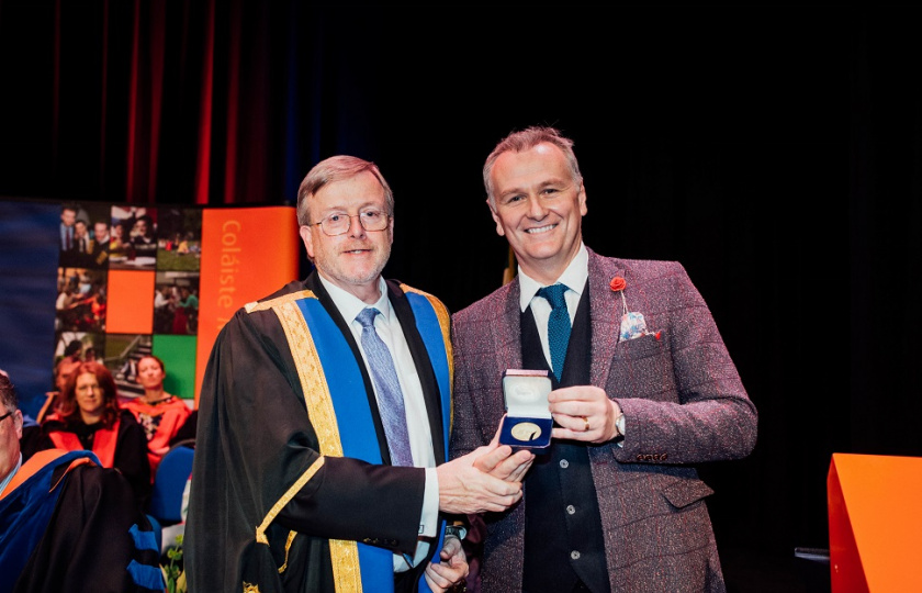Professor Eugene Wall presents Dáithí Ó Sé with his Alumnus of the Year award