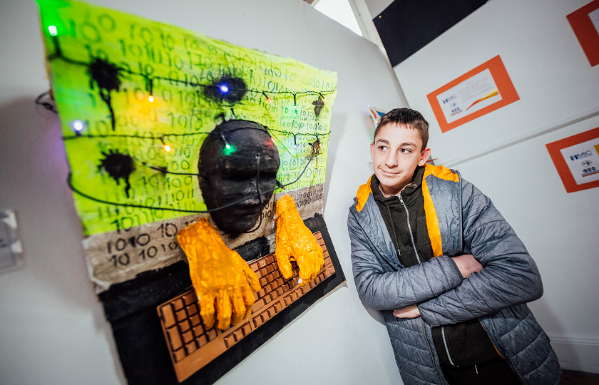 Calvin Ambrose pictured with his artwork, which is part of the exhibition 'Identity' at Mary Immaculate College, Limerick 