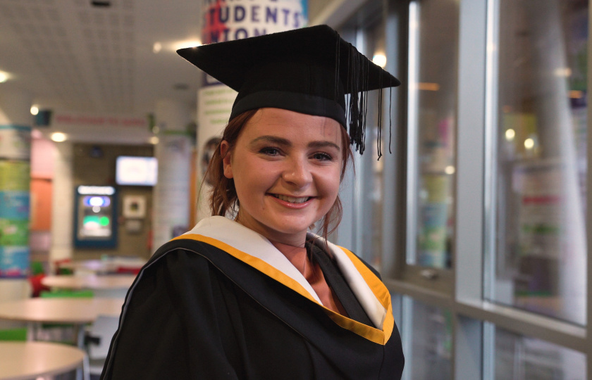 BA student in graduation robes about to graduate from Mary Immaculate College