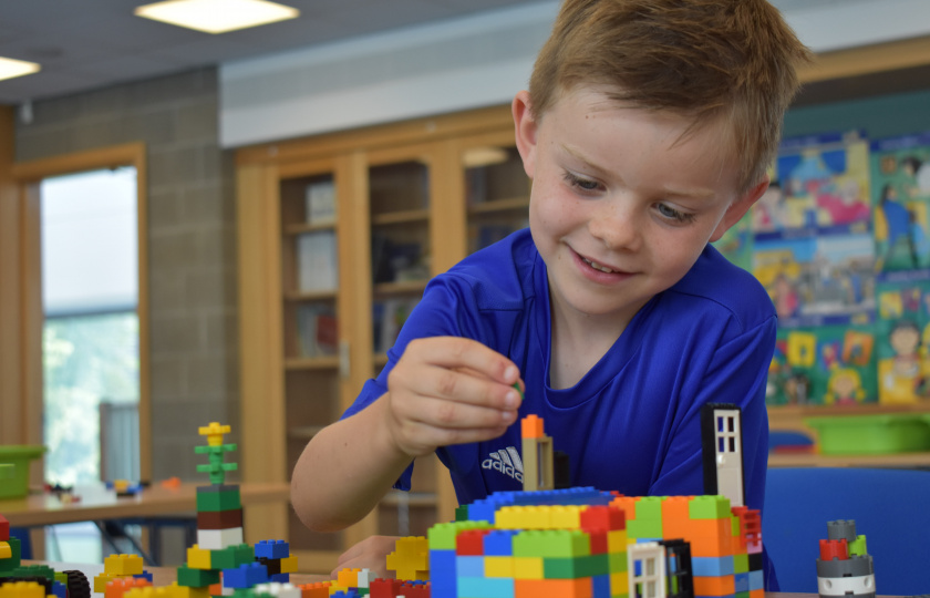 Image of child playing with lego