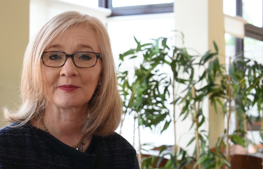 Dr Geraldine Brosnan pictured to the left of screen plants in the background 