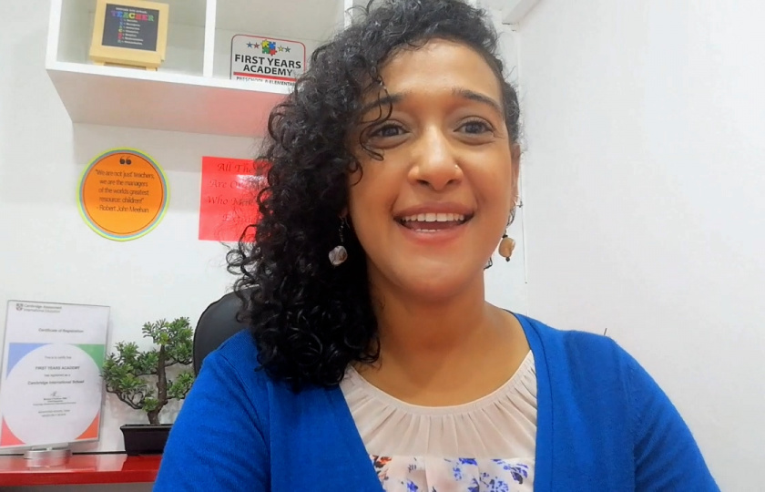 Marziya sitting at a desk