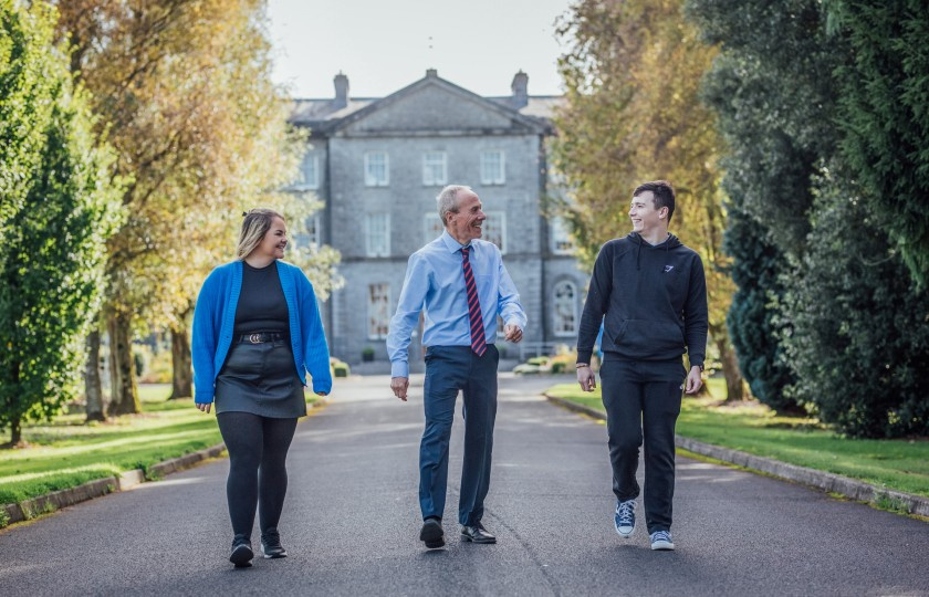 Three MIC Green Campus Thurles members in front of campus building