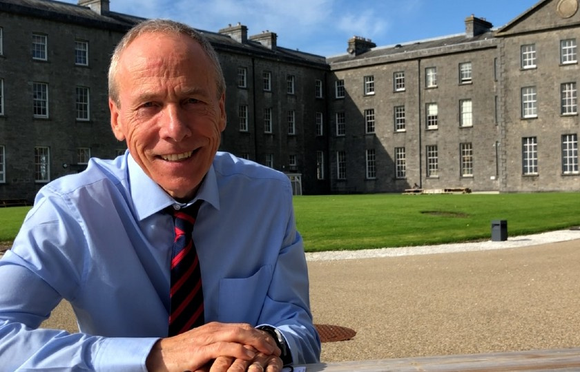 Dr Nigel Quirke-Bolt sitting in front of MIC Thurles campus building
