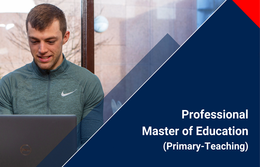 Male student smiling and looking into laptop screen