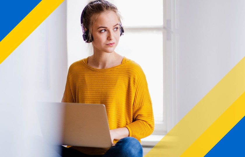 Female student sitting in front of laptop