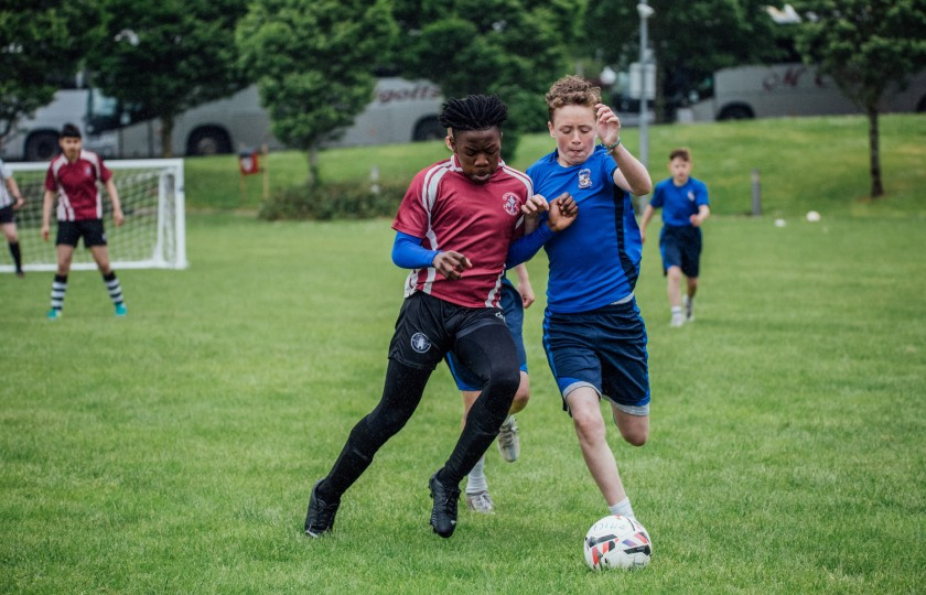 CBS' Mduduzi Ncube and Le Cheile's Thomas Ryan jostle for the ball