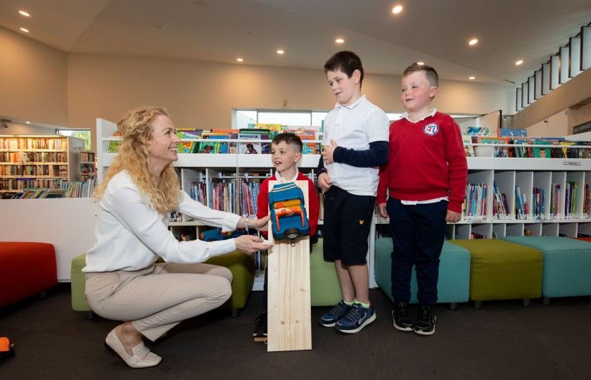 Dr Maeve Liston with three school children at Kilmallock library during the launch of the festival