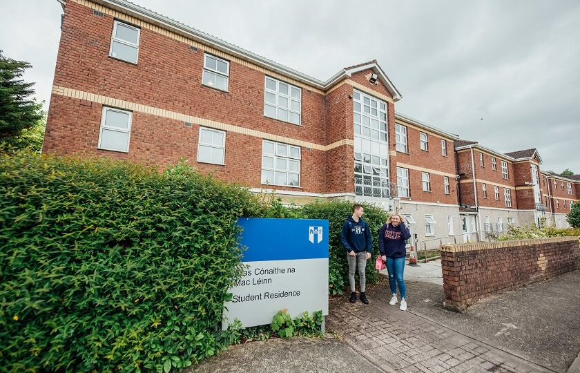 Courtbrack Accommodation exterior with male and female students walking by