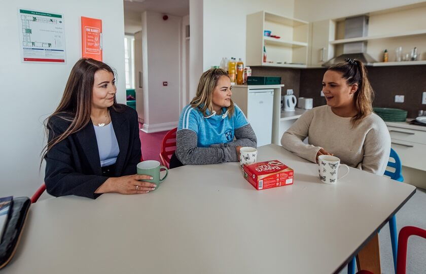 MIC Thurles three female students sitting at a table having tea