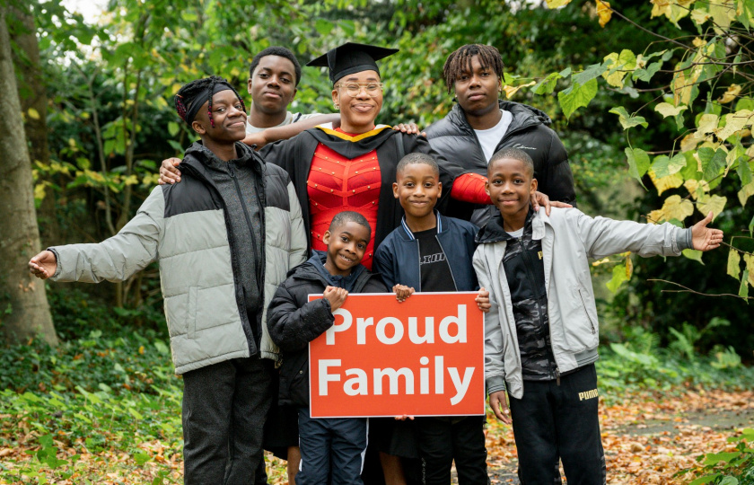 New graduate Joy Bala-Ahmed and here family on the grounds of MIC on graduation day.