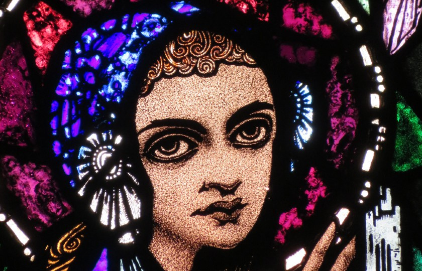 A stain glass depiction of St Brigid