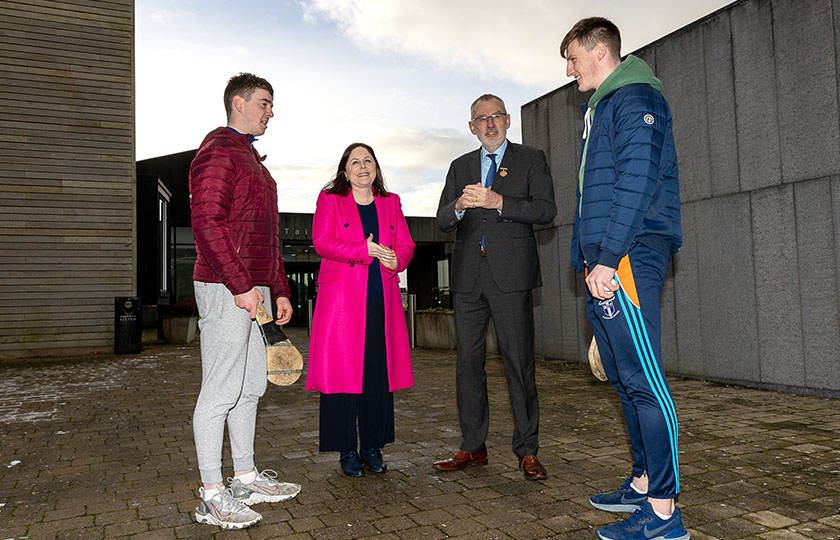 Professor Niamh Hourigan, Vice-President of Academic Affairs, MIC, Uachtarán CLG Larry McCarthy with MIC hurlers Diarmuid Ryan and Michael O'Flynn on the grounds of MIC Limerick campus.