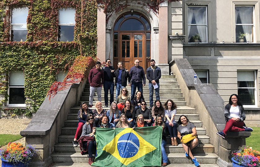 International students from Brazil on the steps outside MIC foundation building.