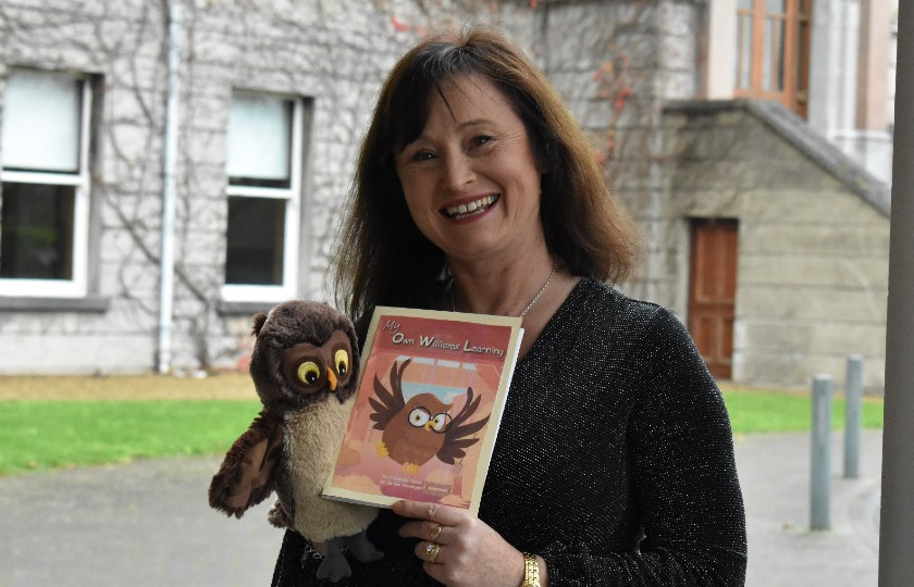 Author Fionnuala Tynan holding her book