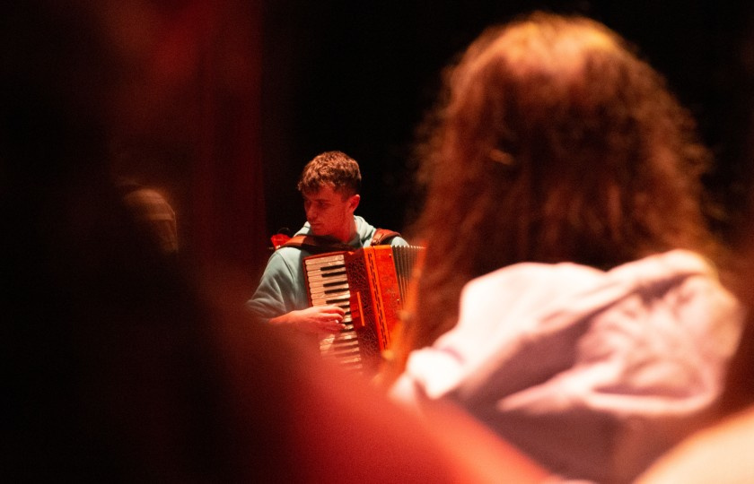 Accordion player performs at an open rehearsal at the Lime Tree Theatre
